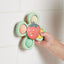 Itzy Ritzy Pop & Whirl Fidget Spinner Travel & Bath Toy - Strawberry on Luna Baby Store Miami