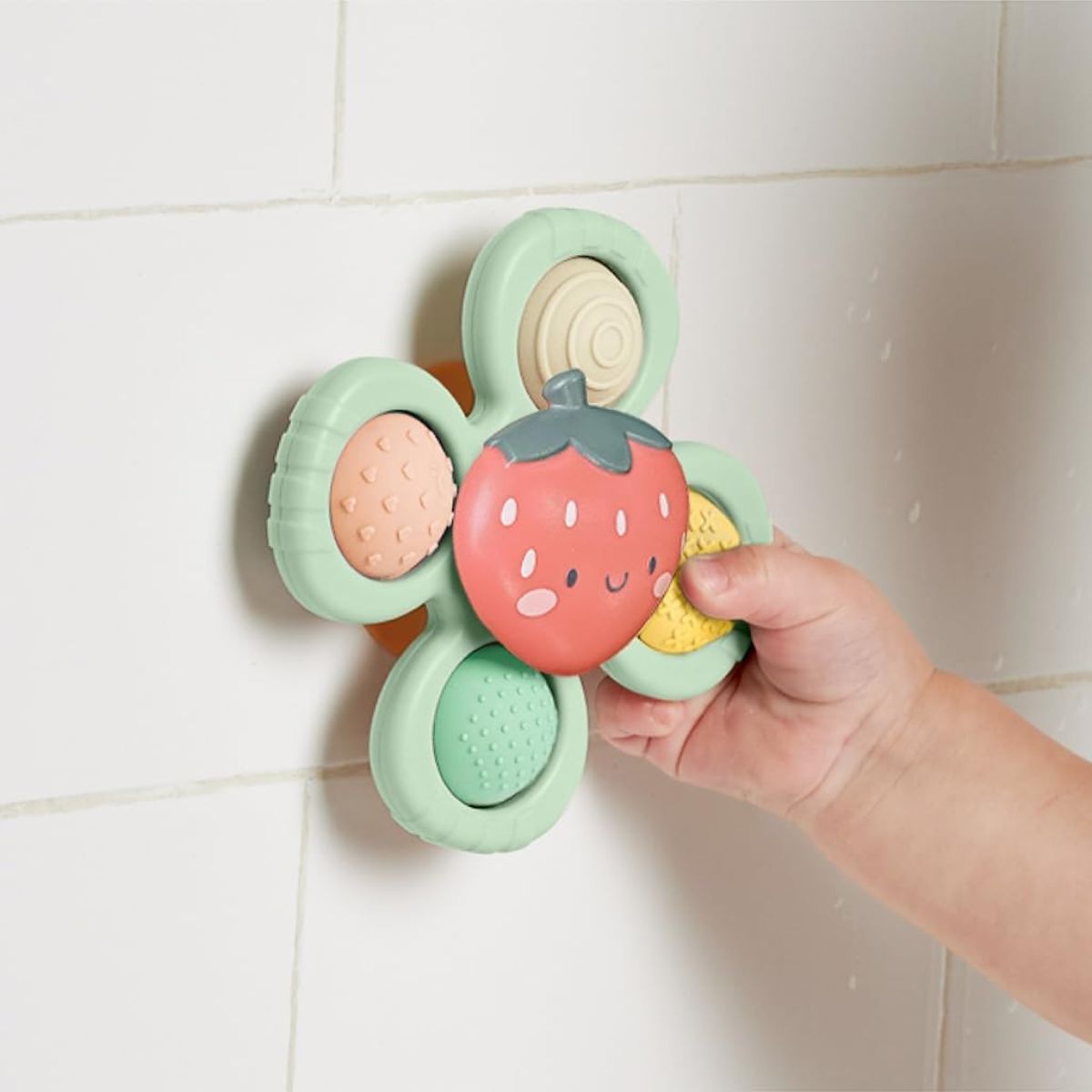 Itzy Ritzy Pop & Whirl Fidget Spinner Travel & Bath Toy - Strawberry on Luna Baby Store Miami